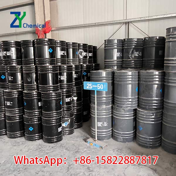 Bulk stock of 25 50mm calcium carbide steel drums in factory warehouse